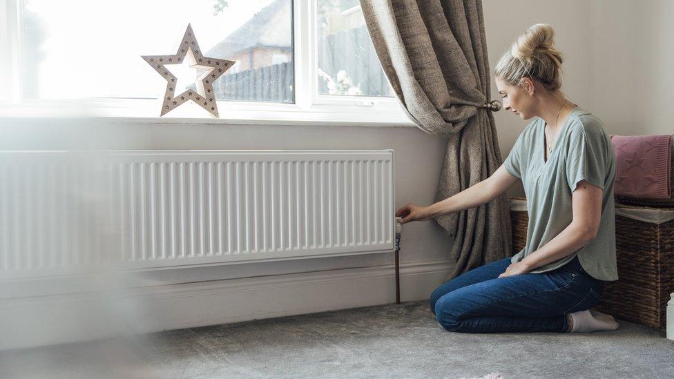 Woman at radiator