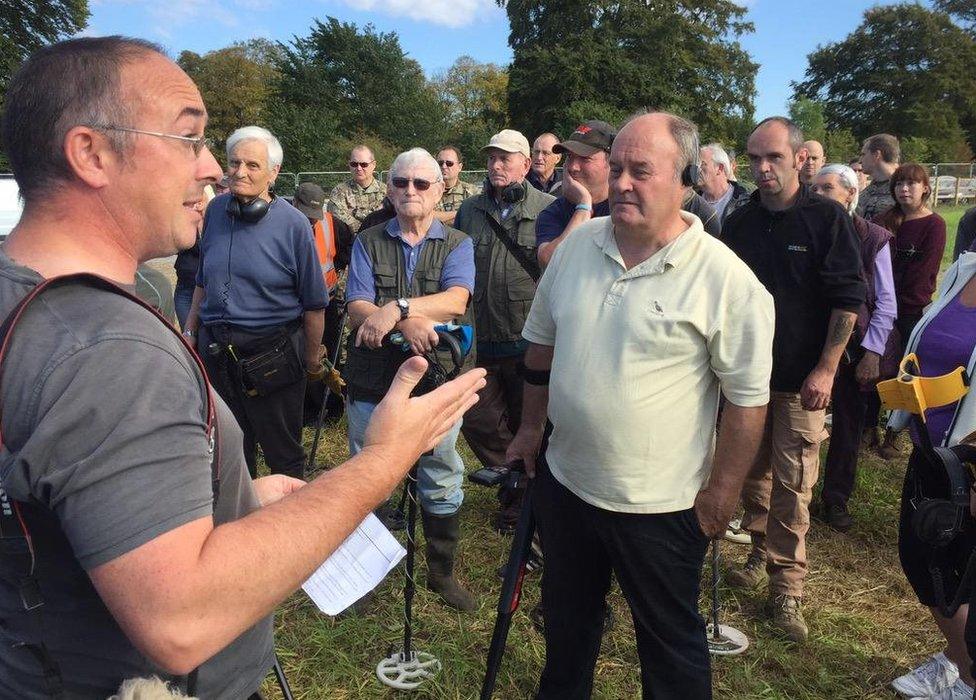 People being briefed before the search