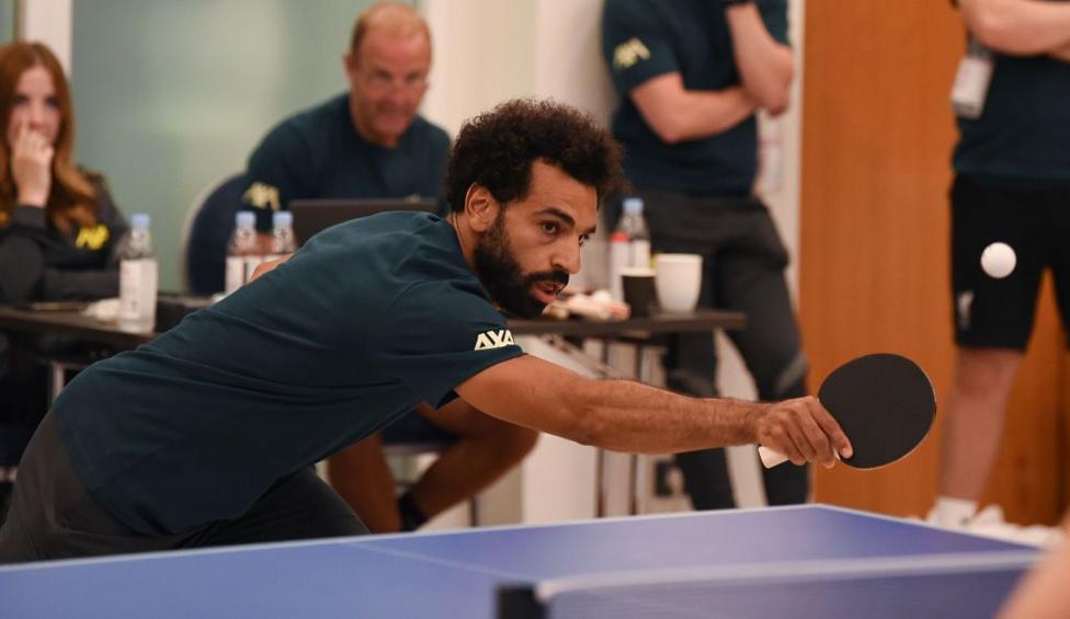 Mohamed Salah plays table tennis during a pre-season training camp with his Liverpool team-mates in 2021