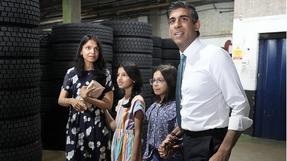 Conservative Leadership hopeful Rishi Sunak with daughters Krisna, Anoushka and wife Akshata Murthy after making a speech while campaigning on July 23, 2022 in Grantham, England. Former Chancellor Rishi Sunak has chosen Grantham, a Conservative party heartland and the home town of former PM Margaret Thatcher, as the next stop of his campaign to become the leader of the Conservative party and Prime Minister