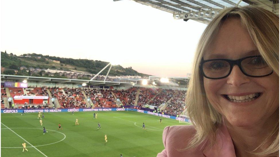 Image of a woman taking a selfie from the stand at the New York Stadium in Rotherham