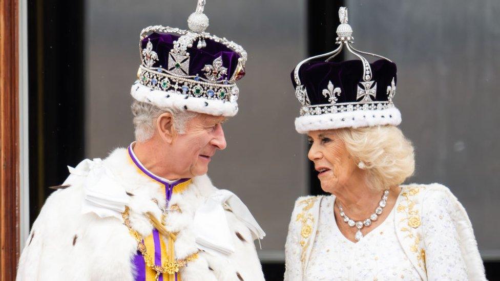 king Charles and his Queen consort Camilla wearing their crowns during the coronation