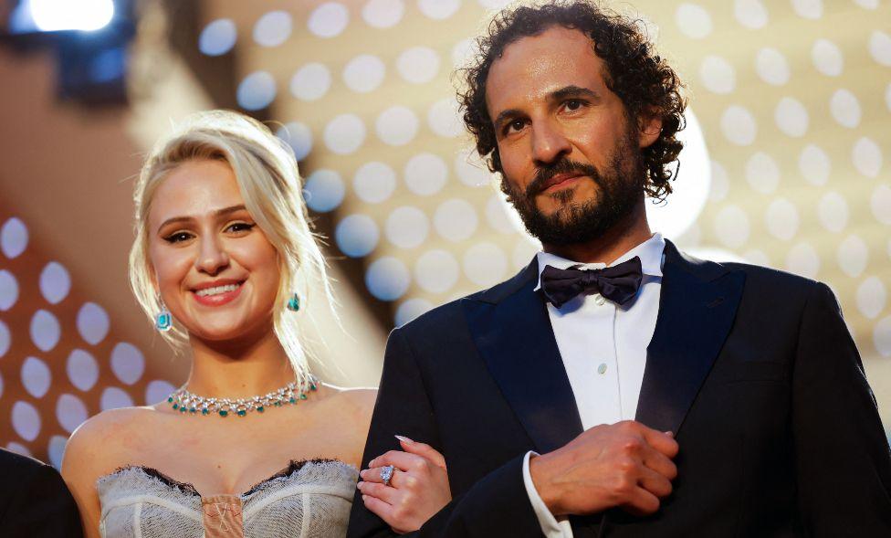 Director Ali Abbasi and cast member Maria Bakalova leave following the screening of the film "The Apprentice" in competition at the 77th Cannes Film Festival in Cannes, France, May 20, 2024