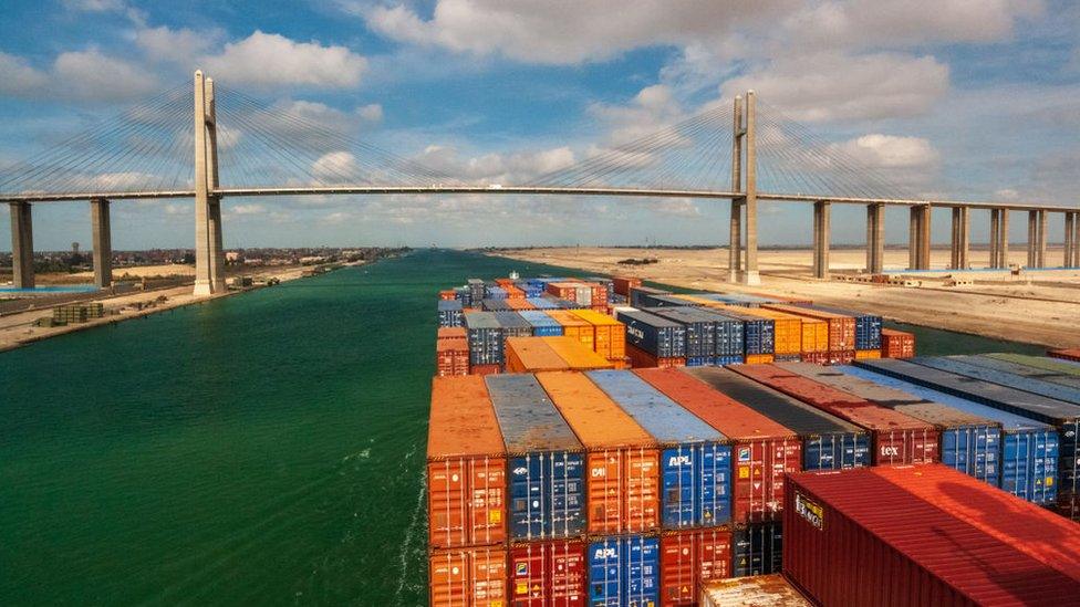 Ship passes under a bridge on the Suez Canal in 2017