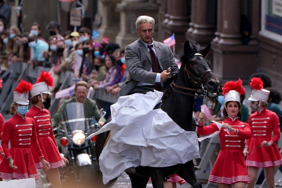 A body double for Harrison Ford and Boyd Holbrook are seen on a horse and motorbike