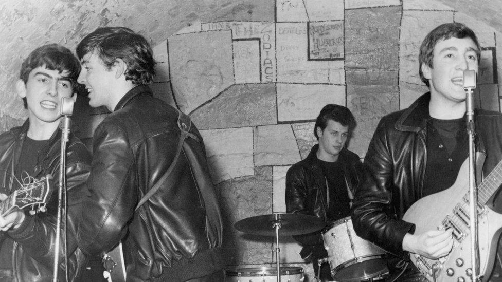 The Beatles performs onstage at the Cavern Club in February 1961 in Liverpool, England. (L-R) George Harrison, Paul McCartney, Pete Best, John Lennon