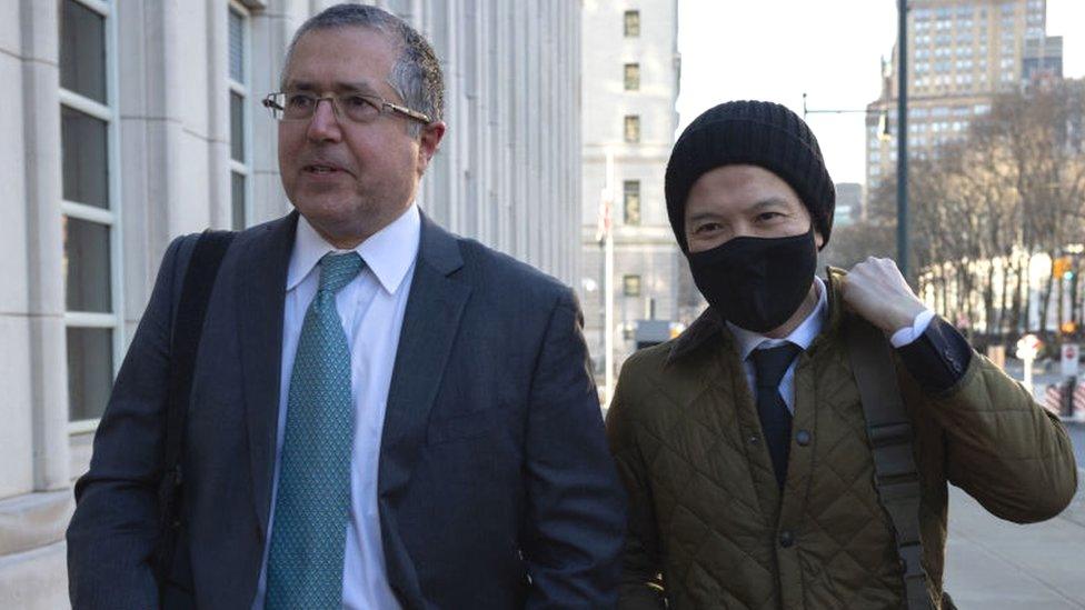 Lawyer Marc Agnifilo (L) and former Goldman Sachs banker Roger Ng (R) arrive at the US Federal Court.