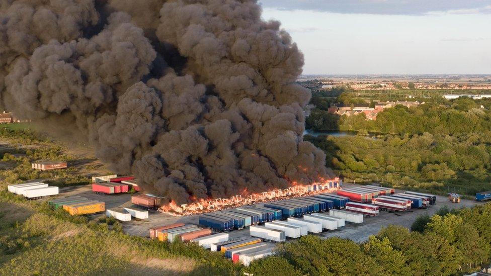 Fire engulfing several lorry trailers