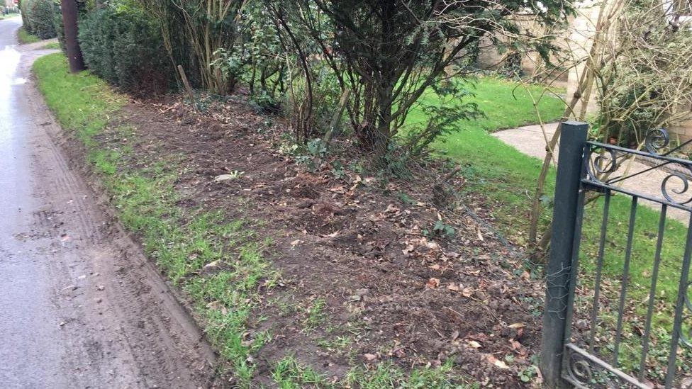 The gap in Mr Wells's front garden where the new hedge was going to be