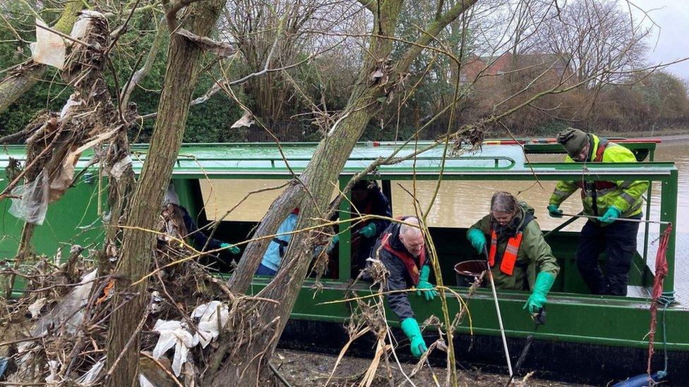 Volunteers using a narrowboat