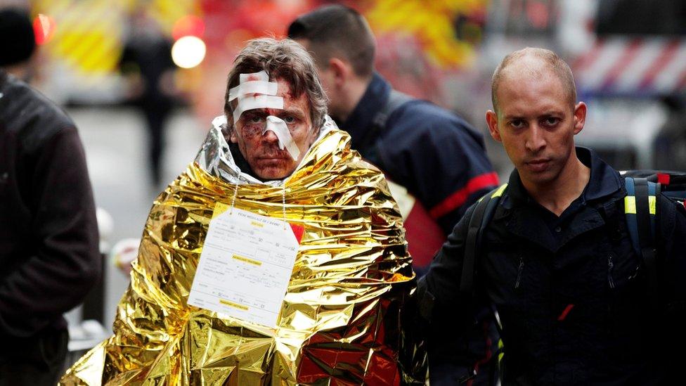 Emergency personnel help injured persons at the scene of an explosion at a bakery near Rue de Trevise in Paris, France, 12 January 2019.