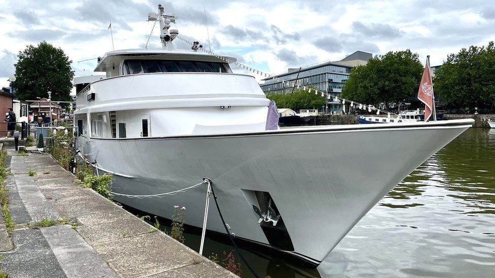 Yacht 'Miss Conduct' with Bristol's Floating Harbour in the background