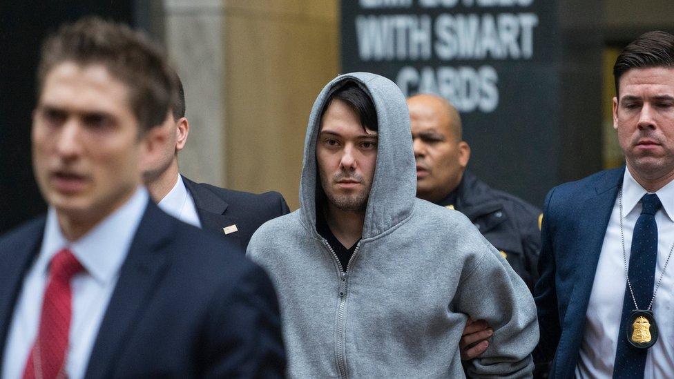 Martin Shkreli, the former hedge fund manager under fire for buying a pharmaceutical company and ratcheting up the price of a life-saving drug, is escorted by law enforcement agents in New York