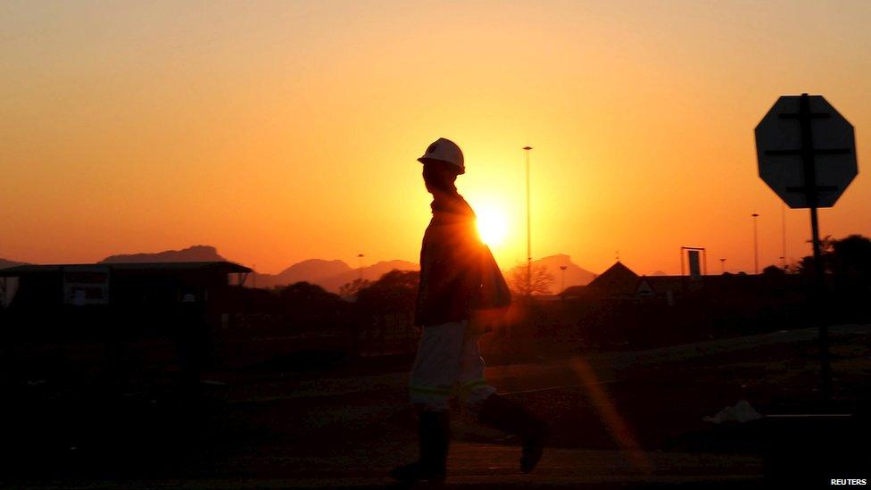 A miner returns from his shift in Nkaneng township outside the Lonmin mine in Rustenburg, northwest of Johannesburg, June 26, 2015