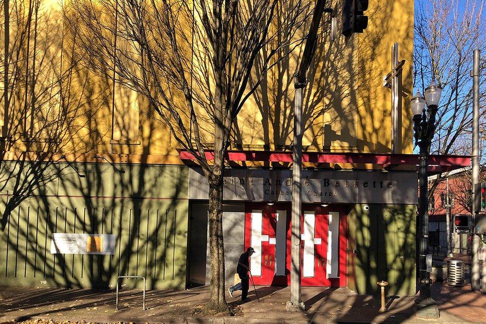 Shadows of trees on the side of a building