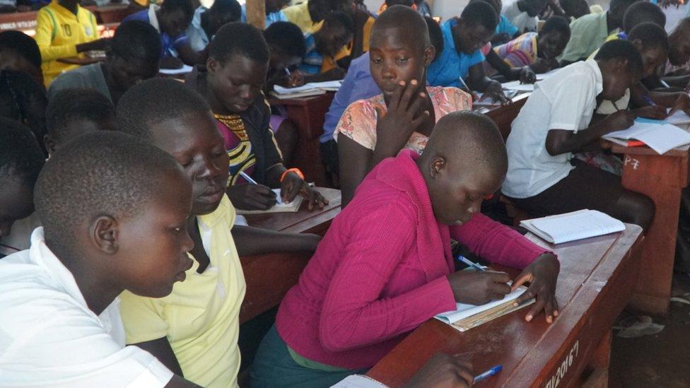 Children at their desks at a Ugandan school