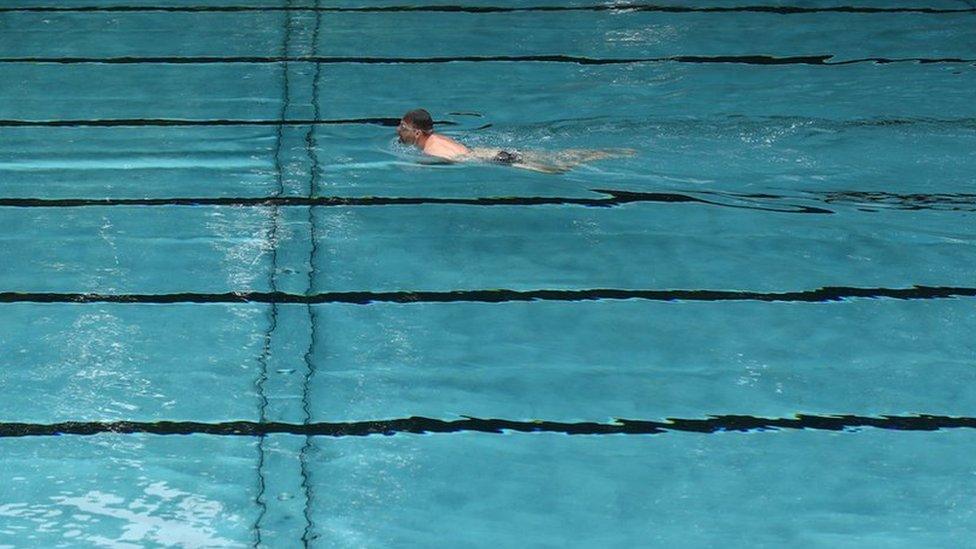 Man swimming in a pool