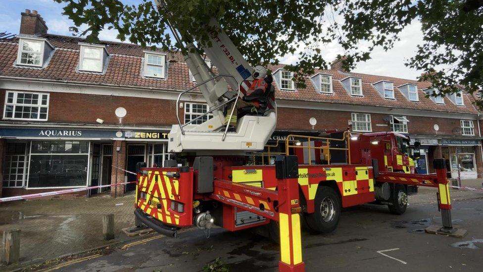 Fire engine next to parade of shops