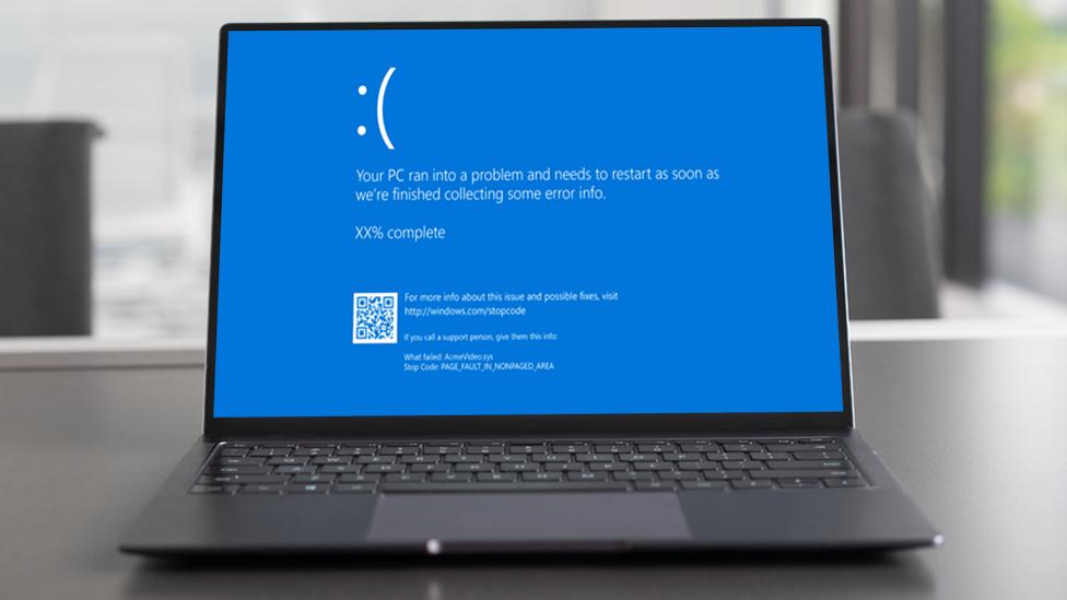 Stock image composite of the blue screen on a laptop