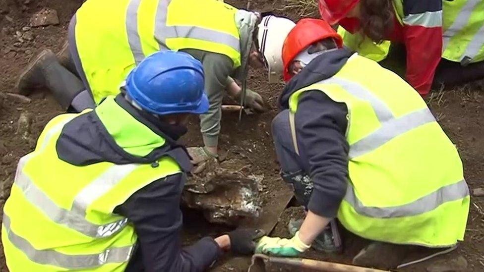 Students digging for the crashed planed