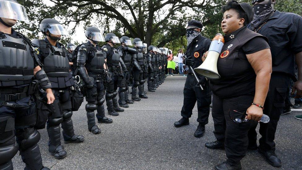 Demonstrators protest the shooting death of Alton Sterling near the headquarters of the Baton Rouge Police Department in Baton Rouge, Louisiana, U.S. July 9, 2016.