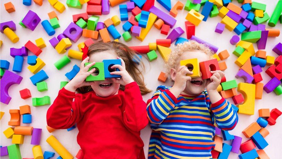 Children playing with bricks