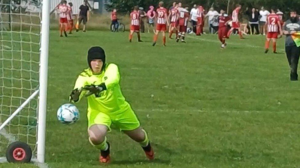 Austin playing football