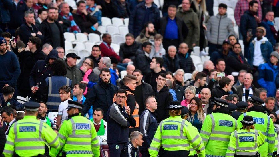 Police move on to the pitch at West Ham v Burnley