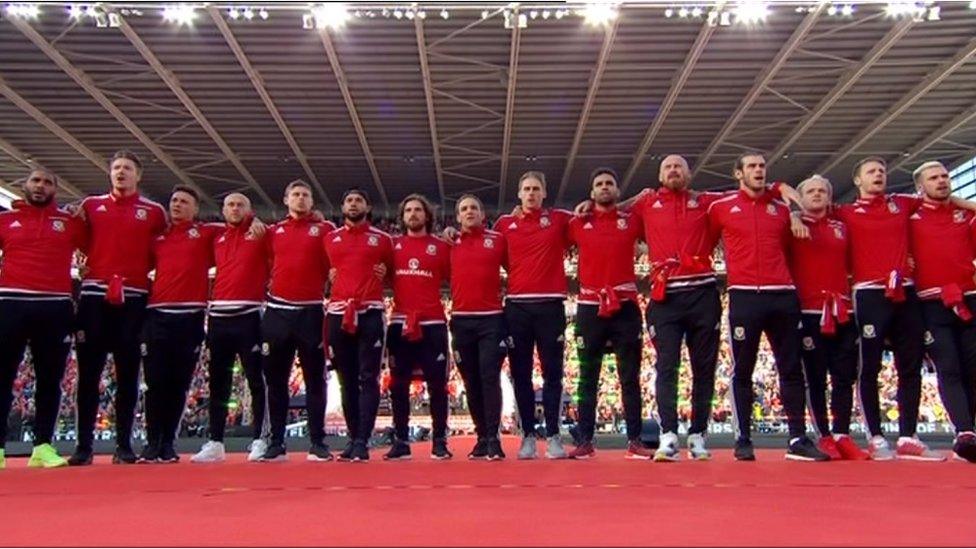 Wales players sing the anthem