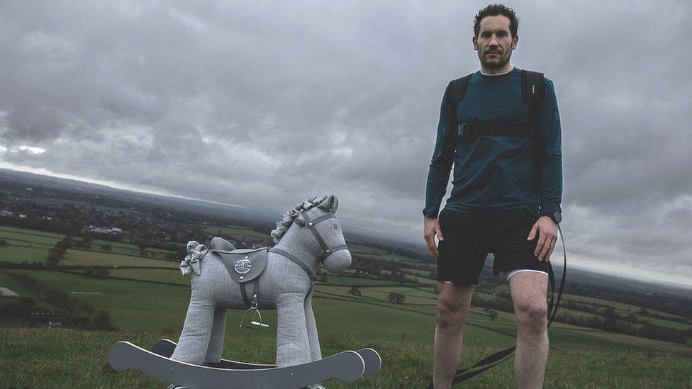 Josh Braid with the rocking horse he will be taking to the South Pole