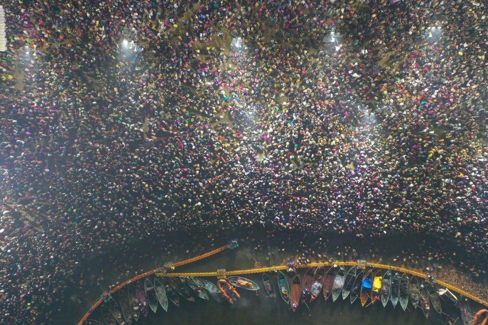 An aerial shot of pilgrims at Kumbh waiting to take a dip