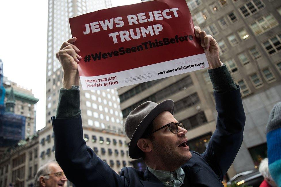 Protestors and members of a Jewish social action group rally against what they call hateful and violent rhetoric from Republican presidential candidate Donald Trump, outside of Trump Tower on Fifth Avenue, September 29, 2016 in New York City