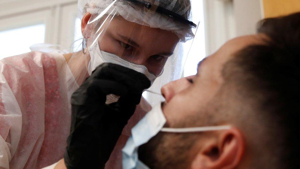 A health worker conducts a coronavirus test in Paris on 9 September