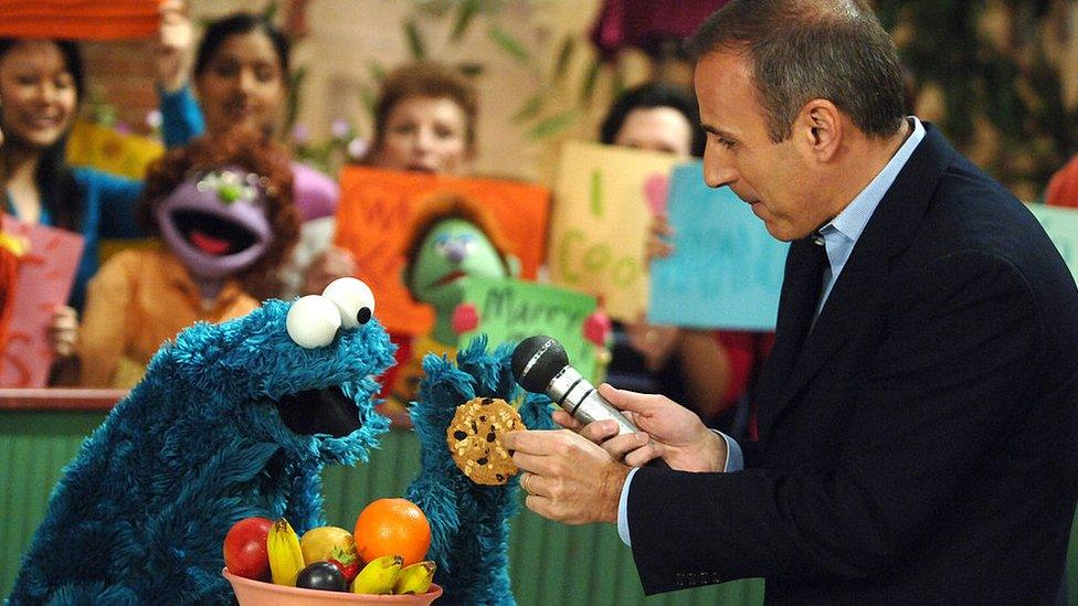 Cookie Monster being interviewed