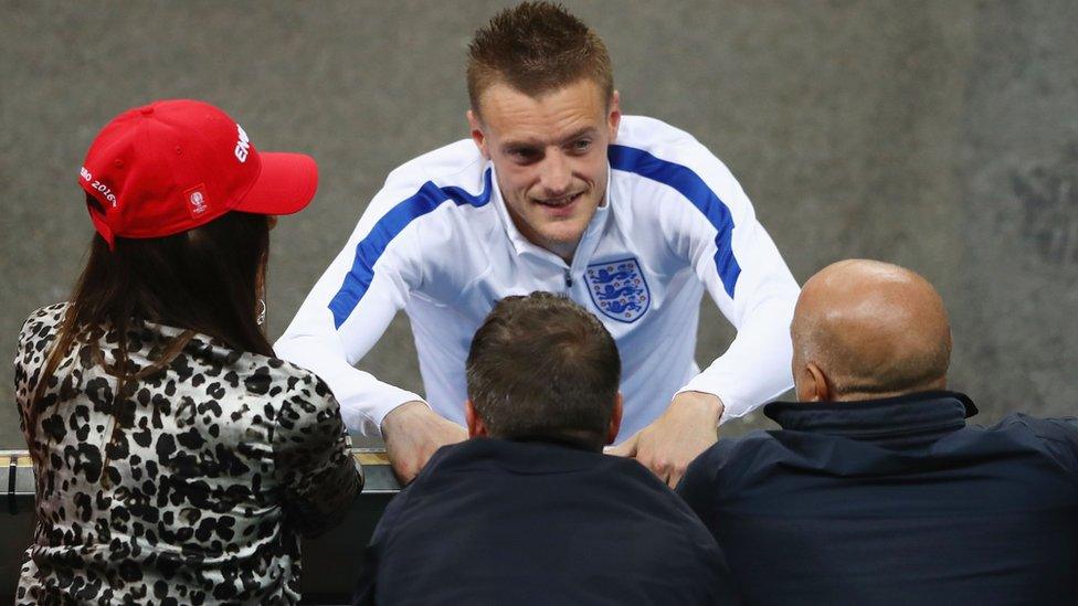 Jamie Vardy talking with his family after the match