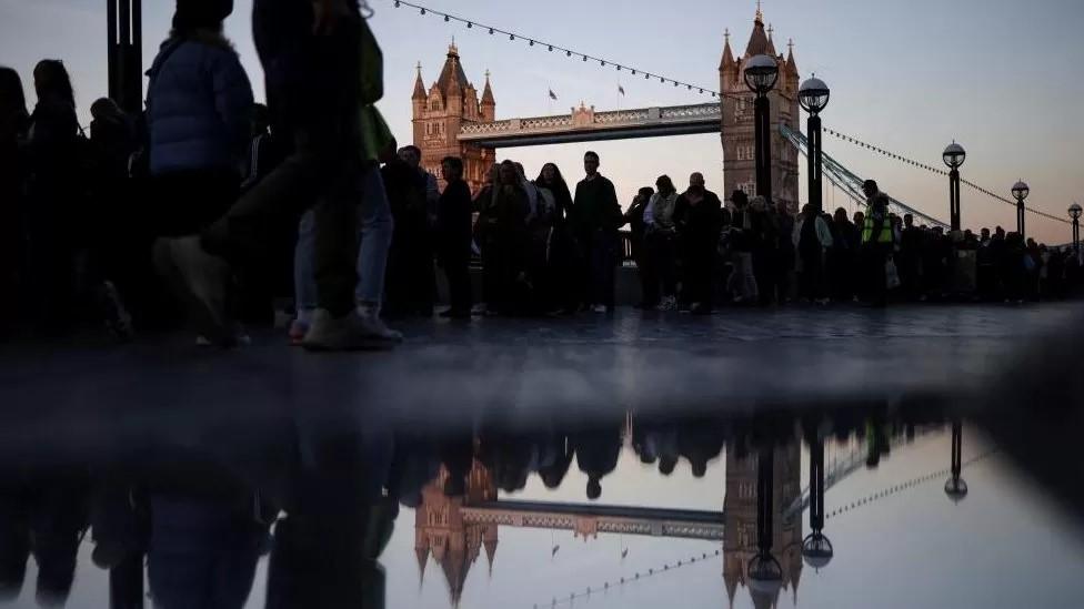 A queue of people near Tower Bridge