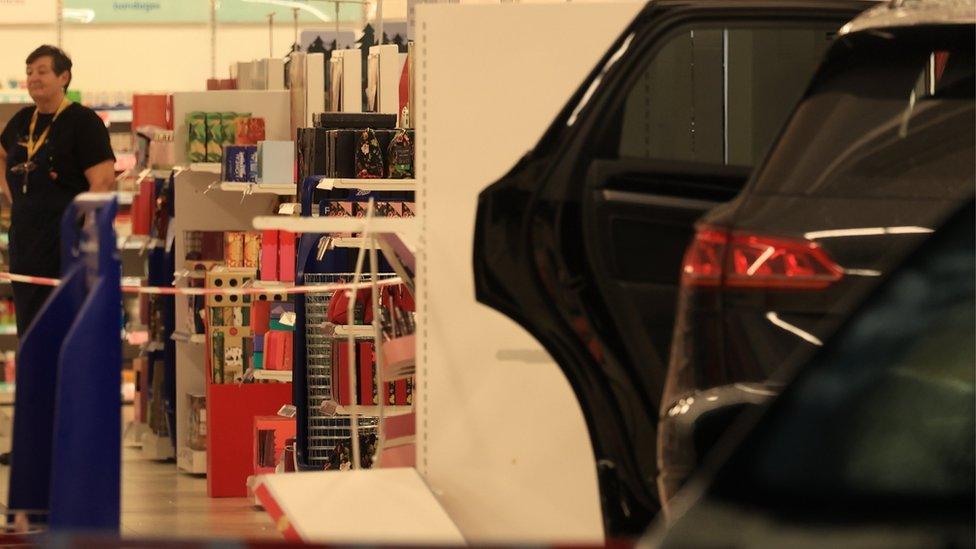 Black Volkswagen crashed through Boots storefront