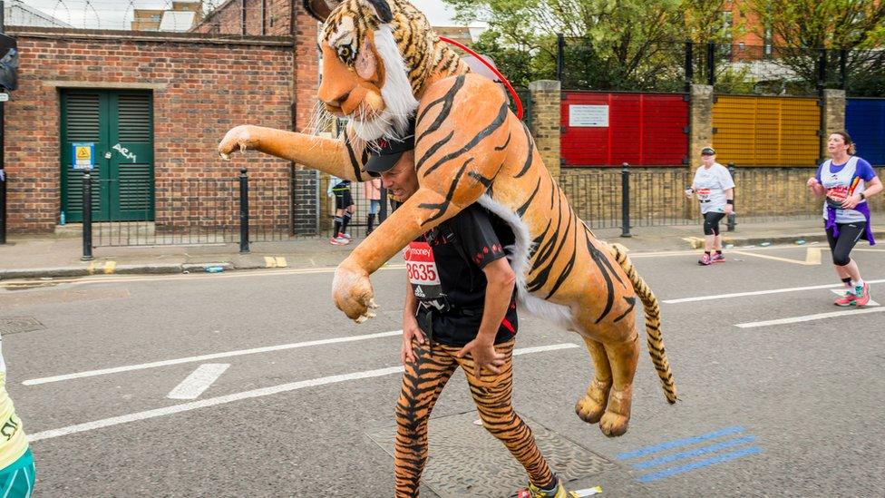 A man running a marathon in a costume