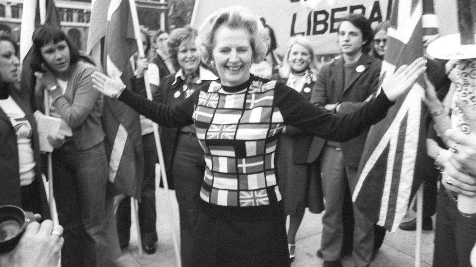 Margaret Thatcher, sporting a sweater bearing the flags of European nations, in Parliament Square during her "Yes to Europe" campaign.