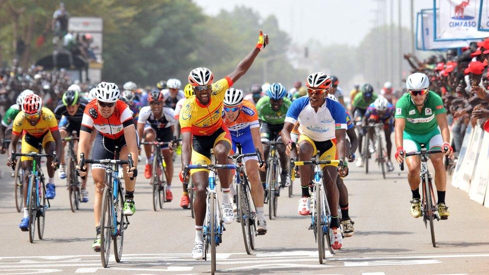 Harouna Ilboudo raises his hand as he crosses the finishing line of the Tour du Faso, Ouagadougou, Burkina Faso - Sunday 6 November 2016