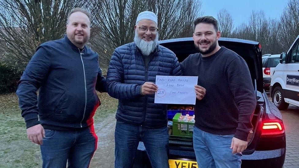 Jonathan Wise (owner of GasWise & DrainWise) and Rowan Ridley presenting the Mayor Fiaz Ahmed with food parcels for the Park Road Masjid Food Bank