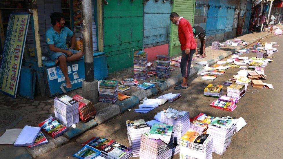 Books laid out to dry in the sun