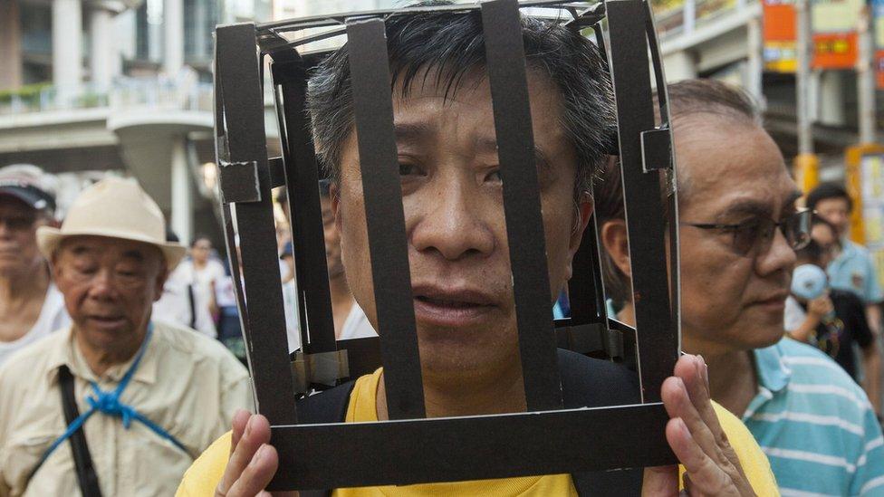 Protesters march in Hong Kong on August 20, 2017