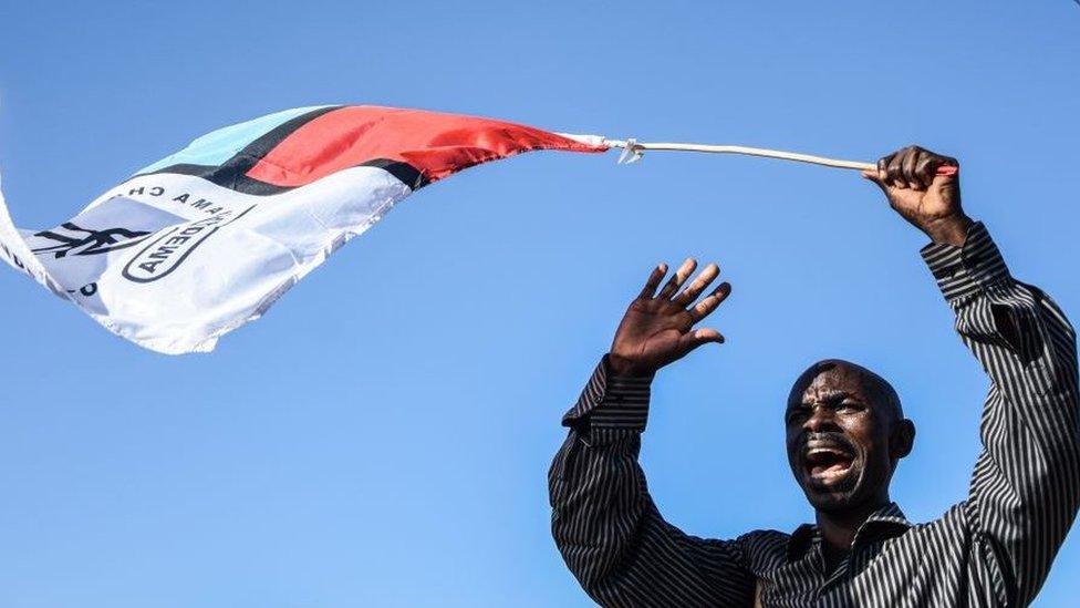 Chadema supporter waving a flag