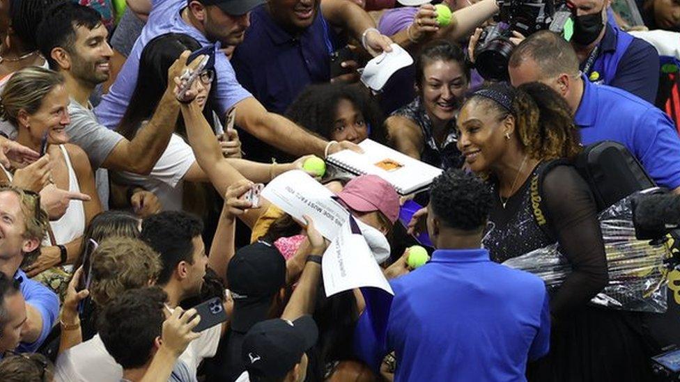 Serena Williams with fans after her US Open first-round match