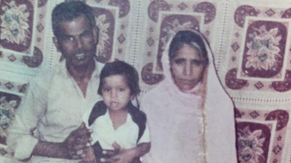 Mohd Ismail's parents with one of his siblings