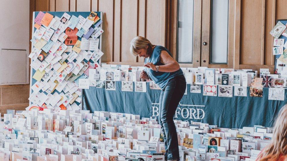 Volunteers helping open cards