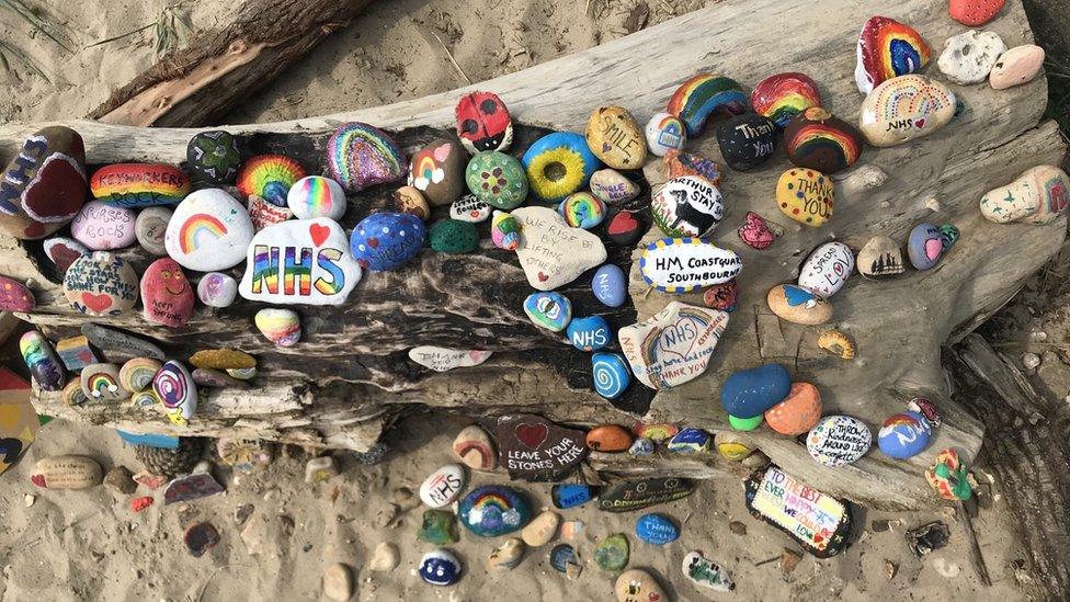 Painted pebbles on Avon Beach in Dorset