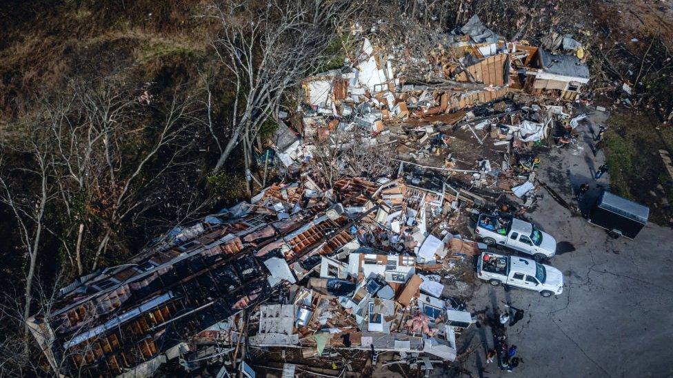 In an aerial view, a mobile home park where three people perished is seen in the aftermath of a tornado on December 10, 2023 in Madison, Tennessee.