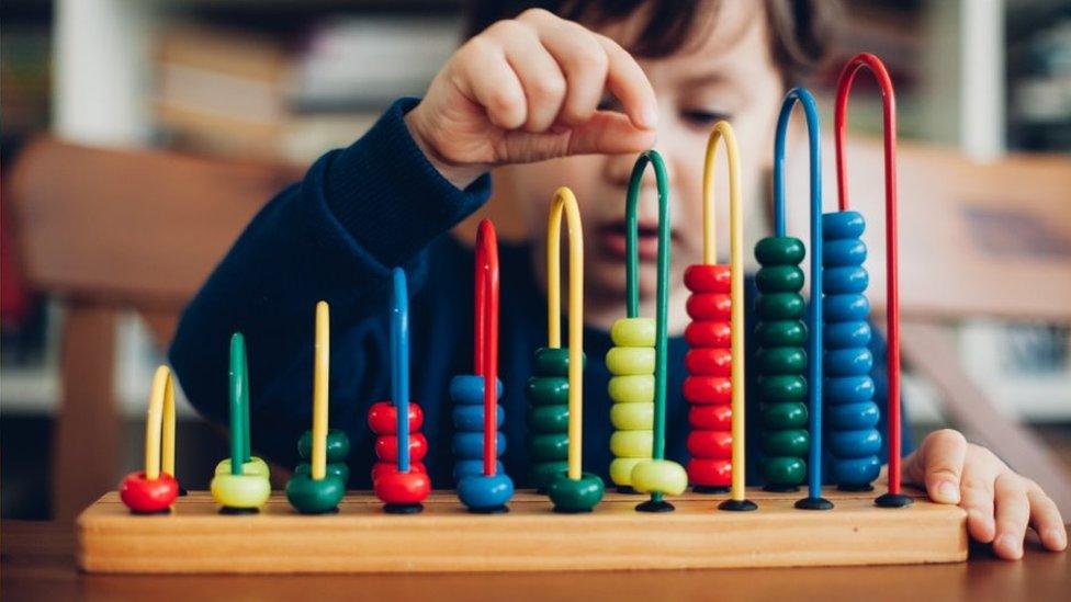 Child with abacus